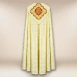 Ecru embroidered liturgical cape with the IHS symbol