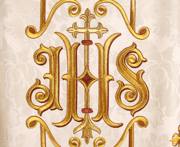 The IHS symbol embroidered with gold thread on liturgical vestments