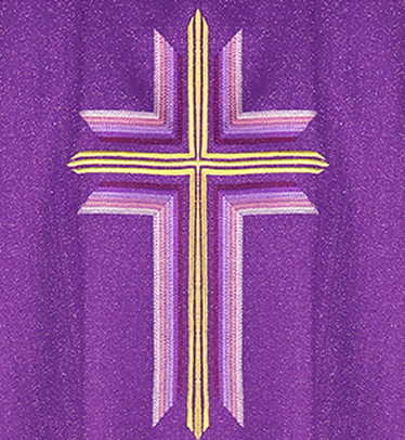 a detail of the cross embroidery on a liturgical chasuble