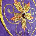 Embroidered purple chasuble with IHS